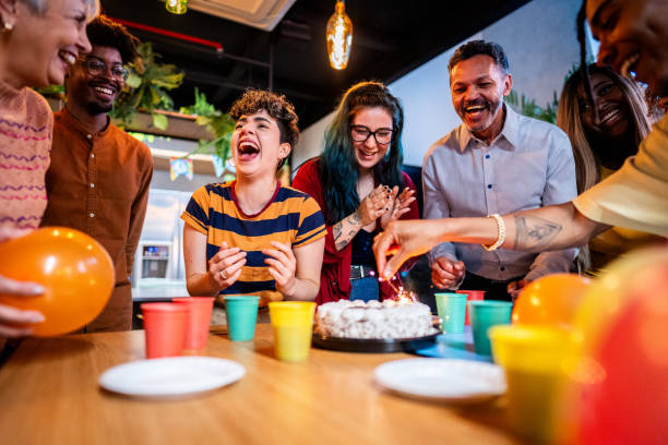 istock Coworkers clapping during a birthday office party 1621290355