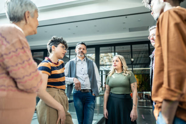 istock Coworkers talking at office lobby 1621302224