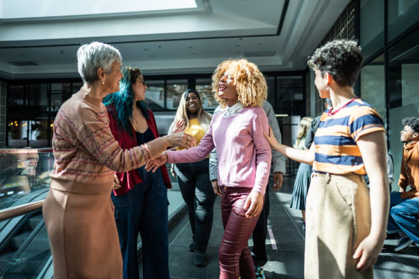 istock Coworkers greeting at office lobby 1621304317