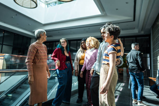 istock Coworkers talking at office lobby 1621304341