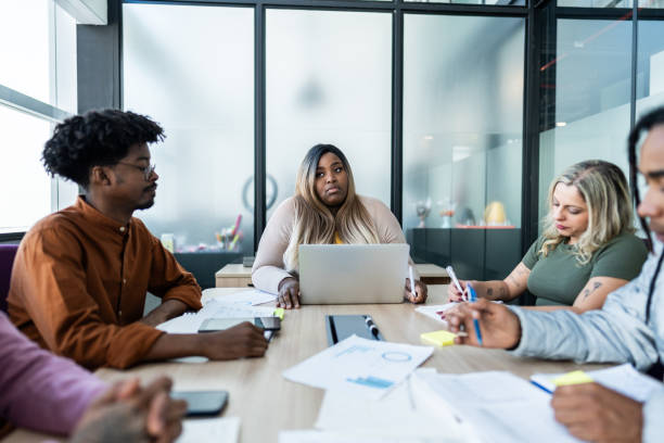 istock Coworkers talking during a meet at office 1621334554
