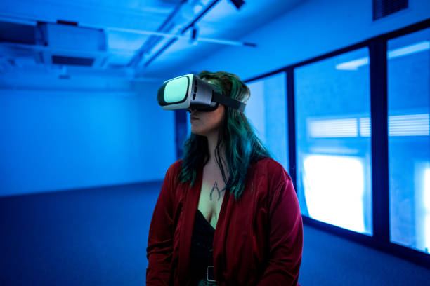Young woman using a VR glasses at office/studio