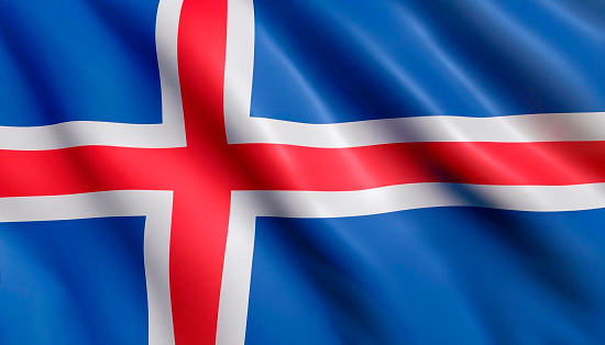 Iceland flag with big folds waving close up under the studio light indoors. The official symbols and colors in fabric banner