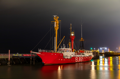 Cuxhaven, Germany - October 27, 2021: former ELBE 1 lightvessel Burgermeister O'Swald in the port of Cuxhaven at night