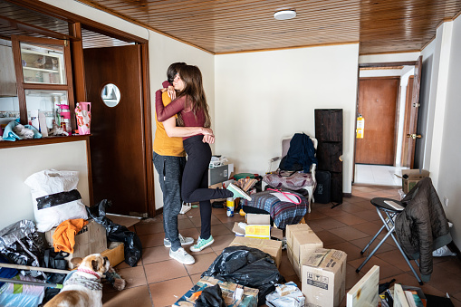 Couple embracing each other at the new apartment