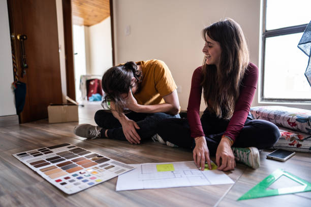 istock Couple talking while making decisions about the new apartment 1621373167