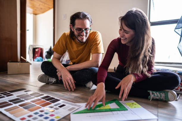 Couple talking while making decisions about the new apartment