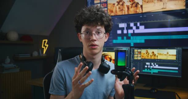 istock Young video maker records video training about film and video editing 1621374217