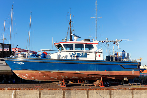 Rescue ship Kapiteins Hazewinkel of the URK KNRM (Koninklijke Nederlandse Redding Maatschappij / Royal Netherlands Sea Rescue Institution) in the harbor of the former island of Urk at the shore of IJsselmeer in Flevoland, The Netherlands during a sunny early springtime day.