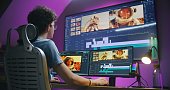 Young editor, video maker edits sound tracks for movie