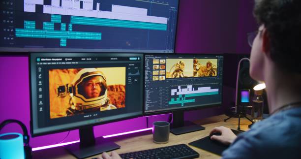 istock Young video maker edits movie on PC at home 1621385506