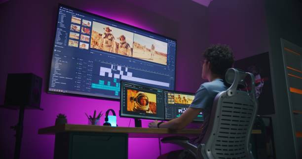 istock Young video maker edits movie on PC at home 1621386534