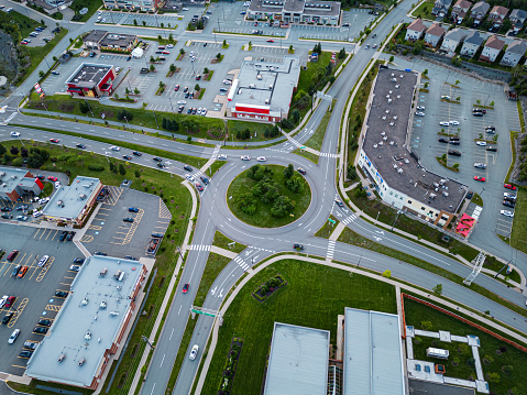 Aerial view of a roundabout surrounded by commercial and retail development.