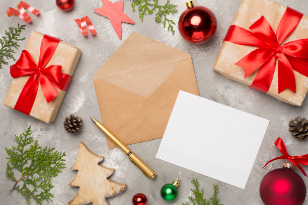 istock Craft envelope with christmas decoration on concrete background, top view 1621395840