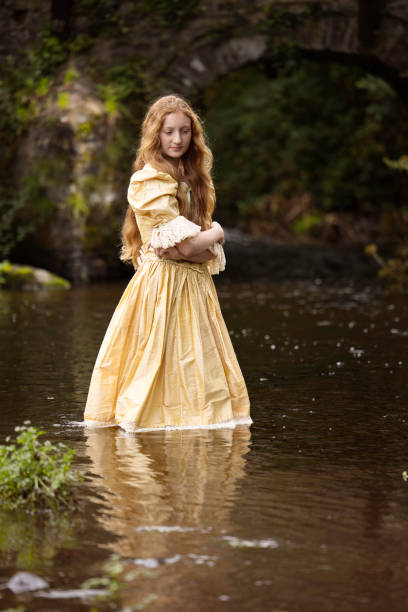 11-year-old blonde standing in a stream in Pembrokeshire, Wales