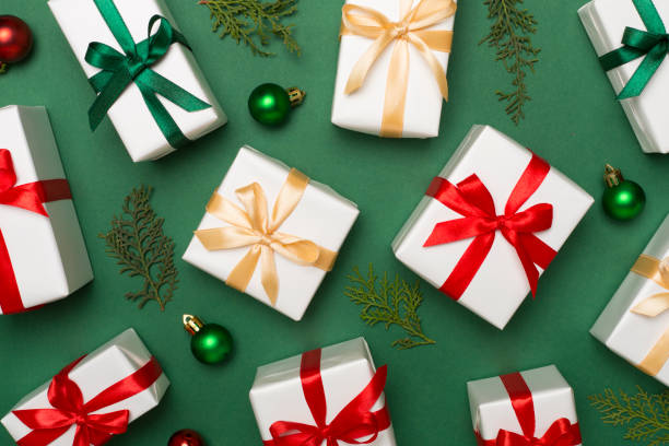 istock Gift boxes with decor on color background, top view 1621395875