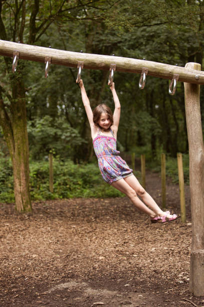 istock Six-year-old girl exercising on climbing equipment 1621396417