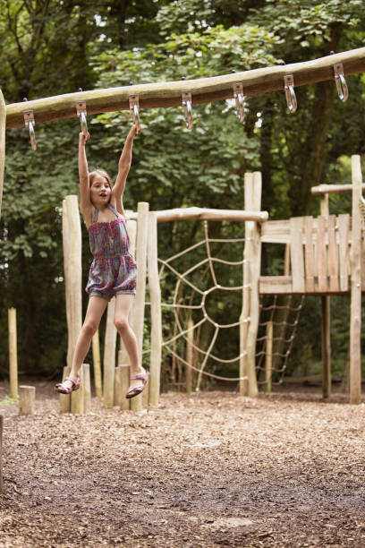 istock Six-year-old girl exercising on climbing equipment 1621396993