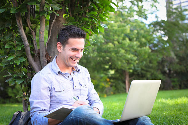 istock Young man relaxing in the park 162140118