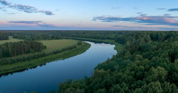 istock Aerial panoramic landscape with sunset over the river with islands and beautiful clouds on the sky. 1621401408