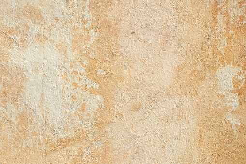 Beautiful Abstract Grunge Decorative  yellow brown Stucco Wall Background. Art Rough Stylized Texture Banner With Space For Text