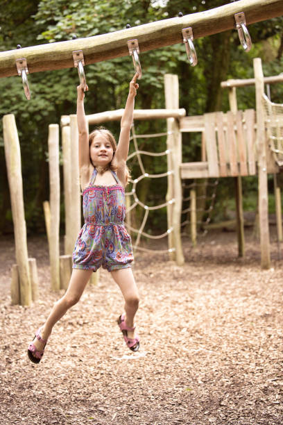 istock Six-year-old girl exercising on climbing equipment 1621404143