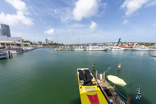 Miami, USA - August 29, 2014: speedboat and other yachts anchor at the harbor downtown Miami.