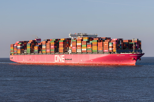 Cuxhaven, Germany - October 24, 2021:  Ocean Network Express (ONE) container ship ONE Cygnus on the river Elbe