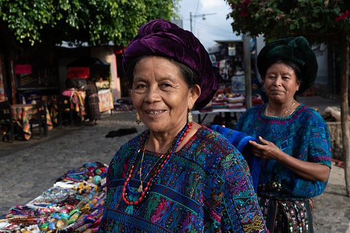 Panajachel Lake Atitlan, Guatemala - October 6, 2019: A Mayan lady is posing and smiling as she sells her clothes on the street of a market in Panajachel at Lake Atitlan.