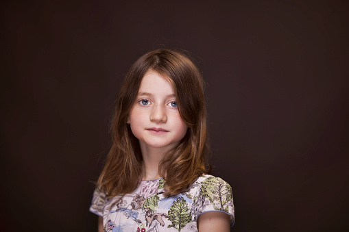 Portrait of a primary-age girl with long, brown hair.