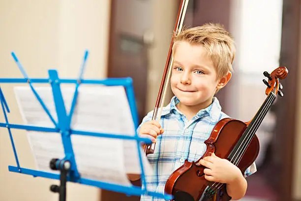 Photo of Little boy and a violin