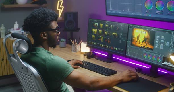 istock African American editor makes color correction, works at home studio 1621442210