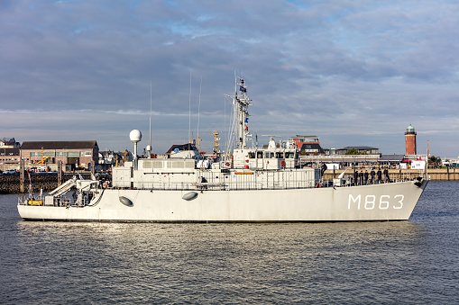 Cuxhaven, Germany - October 25, 2021: Dutch Navy minehunter Vlaardingen leaving the port of Cuxhaven