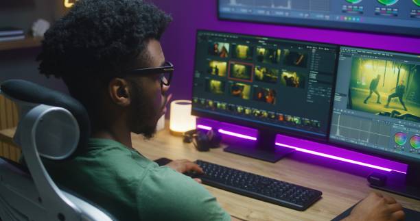 istock African American editor makes color correction, works at home studio 1621444371