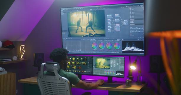 istock African American video maker edits action movie on computer 1621451203