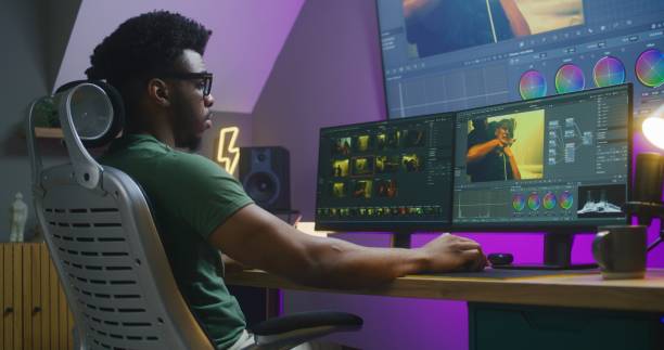 istock African American video maker edits action movie on computer 1621456539