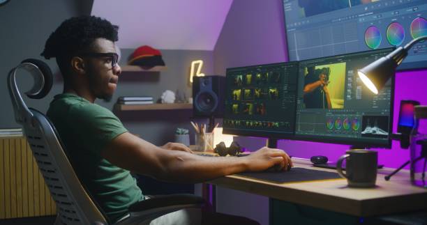 istock African American video maker edits action movie on computer 1621457565