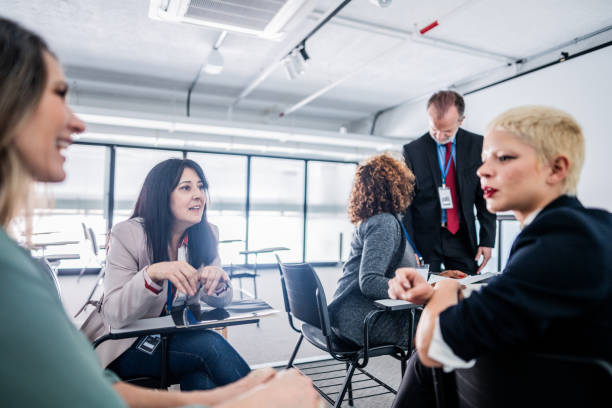 istock Coworkers talking during a business seminar 1621463974