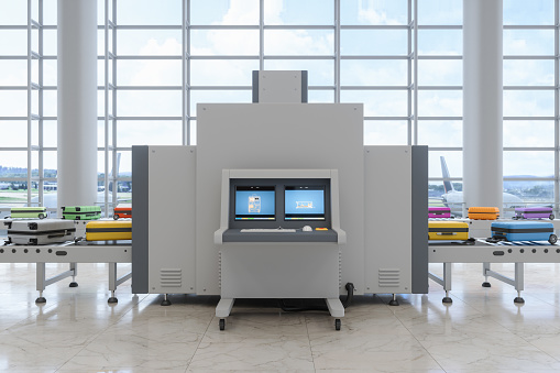 Airport Security Checkpoint With X-Ray Scanner Scanning Luggages