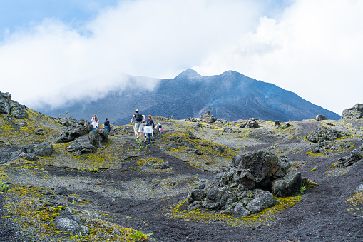 San Vicente Pacaya, Escuintla Guatemala - October 16, 2019: Many young people are getting to know and exploring the Pacaya volcano in Guatemala.