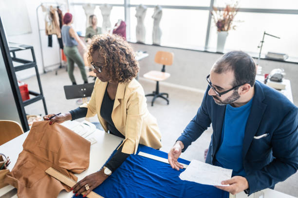 istock Tailors/fashions designers working at atelier 1621484373