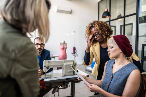 istock Tailors working on a meeting in studio atelier 1621485419