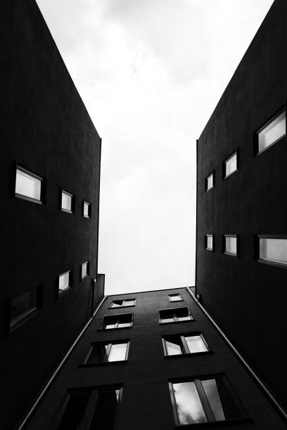 istock Low angle view of building in black and white 1621512731