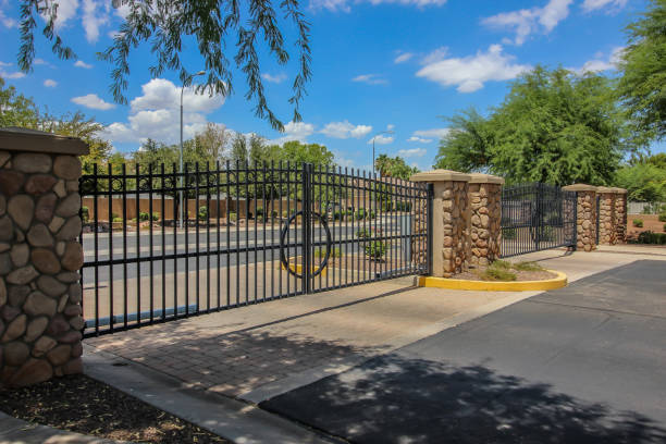 istock Two Metal Security Gates At Housing Subdivision 1621516789