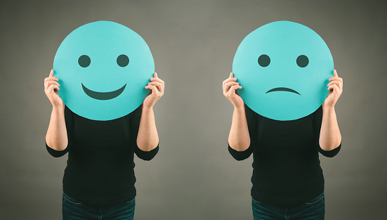 Colorful smileys on chalkboard background