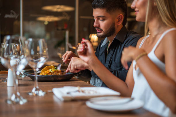 istock Couple is eating in a fancy restaurant 1621538846
