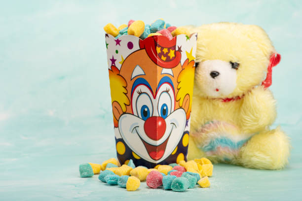 istock Sweets, beautiful colorful candies and accessories positioned on light surface, selective focus. 1621577259