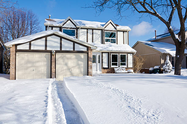 istock House and Driveway Covered with Fresh Snow 162158153
