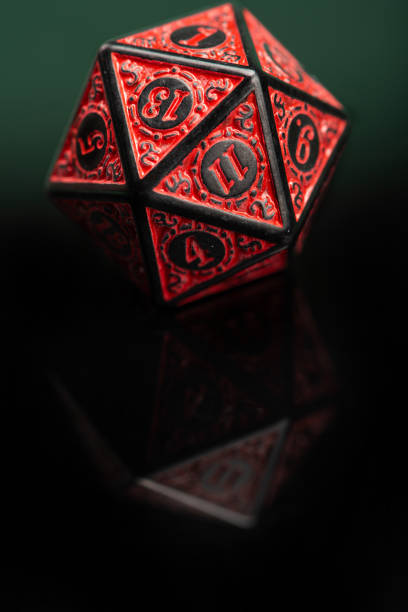 istock RPG dice, beautiful RPG dice placed on reflective surface and dark background, selective focus. 1621606620