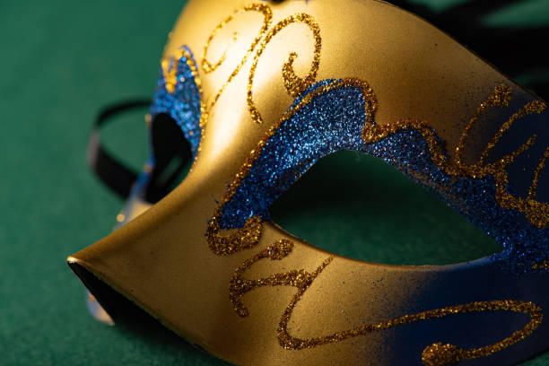 istock Carnival mask, beautiful carnival mask placed on green felt background, selective focus. 1621609186